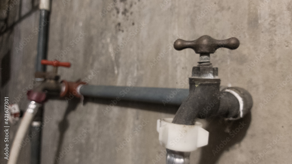 Water taps to feed a washing machine in a backyard Water taps to feed a washing machine in a backyard