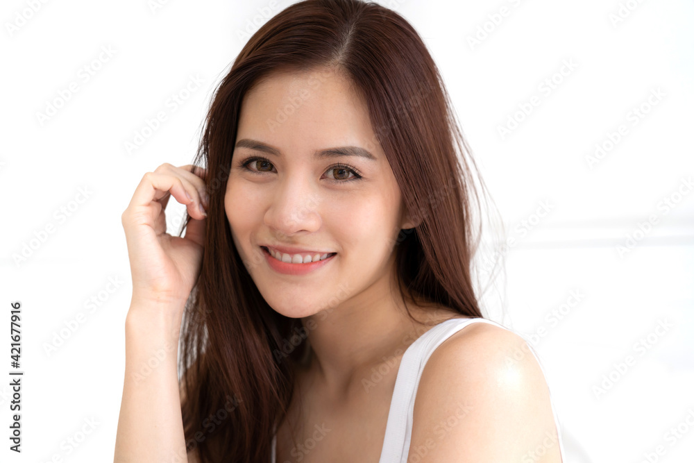 Smiling of cheerful beautiful pretty asian woman clean fresh healthy white skin posing in white clothes.Girl felling relaxing and enjoy time on the bed at home.asia beauty Smiling of cheerful beautiful pretty asian woman clean fresh healthy white skin posing in white clothes.Girl felling relaxing and enjoy time on the bed at home.asia beauty