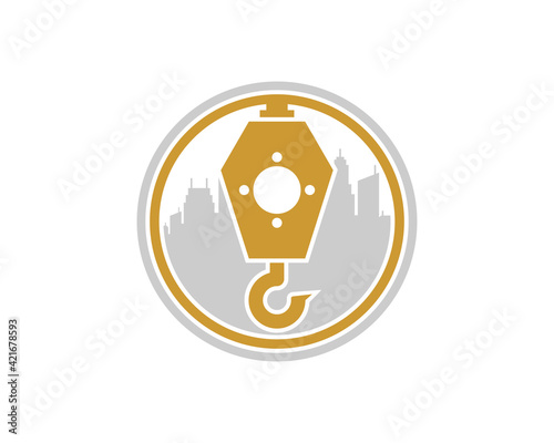 Crane with city building behind in the circle logo