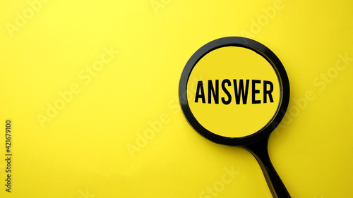 The word "ANSWER" is written on a magnifying glass on a yellow background.