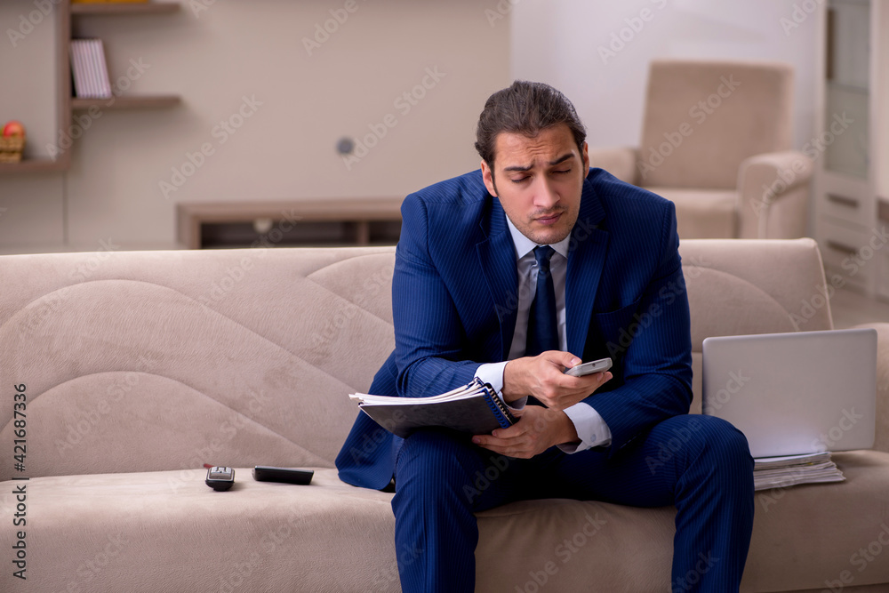 Young male employee working from home in pandemic concept Young male employee working from home in pandemic concept