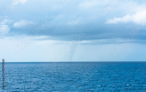landscape view of sea spout (water tornado) in the south Pacific Ocean.