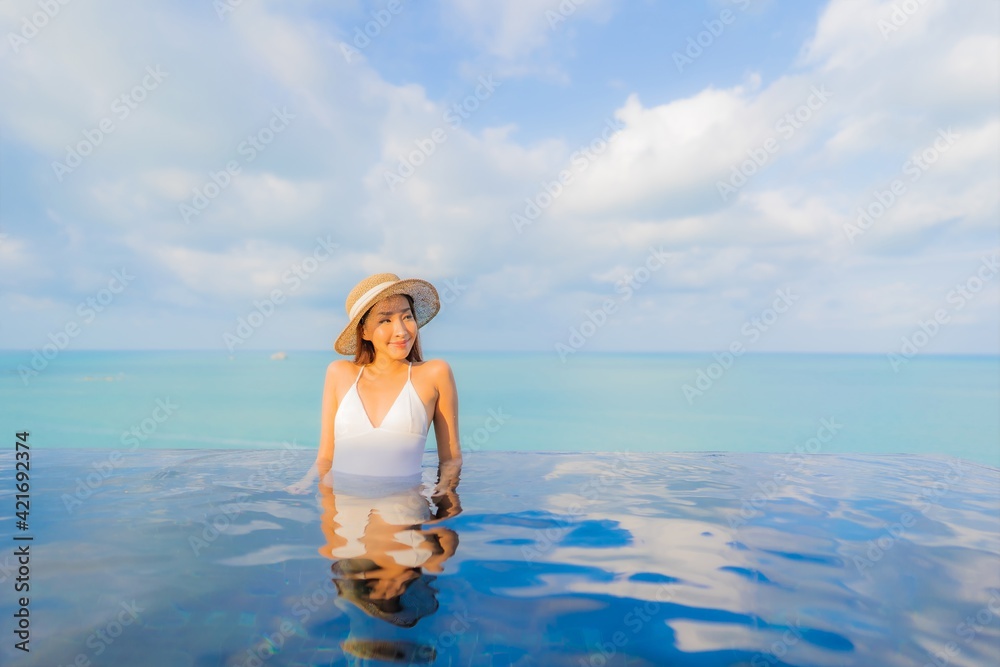 Portrait beautiful young asian woman relax smile leisure around outdoor swimming pool Portrait beautiful young asian woman relax smile leisure around outdoor swimming pool
