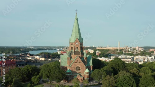 Stockholm, Sweden. Panoramic aerial flying drone view of Södermalm, Sofia church, park, city, and the sea with the archipelago.