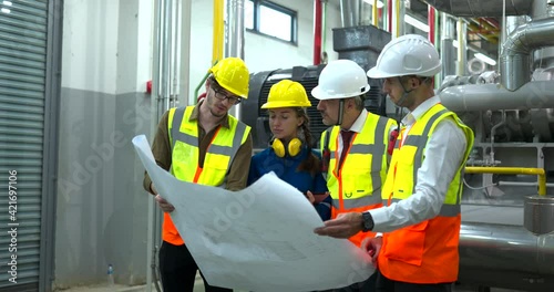 Industry engineering team having discussion work plan in the factory
