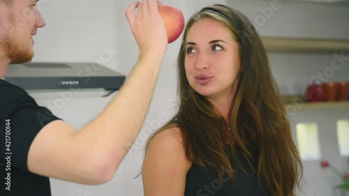 Man and woman couple in casual outfit preparing healthy food for self care in modern kitchen