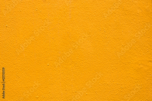 Yellow wall texture background, Yellow or orange painted plaster cement wall vintage style. (For abstract background uses)
