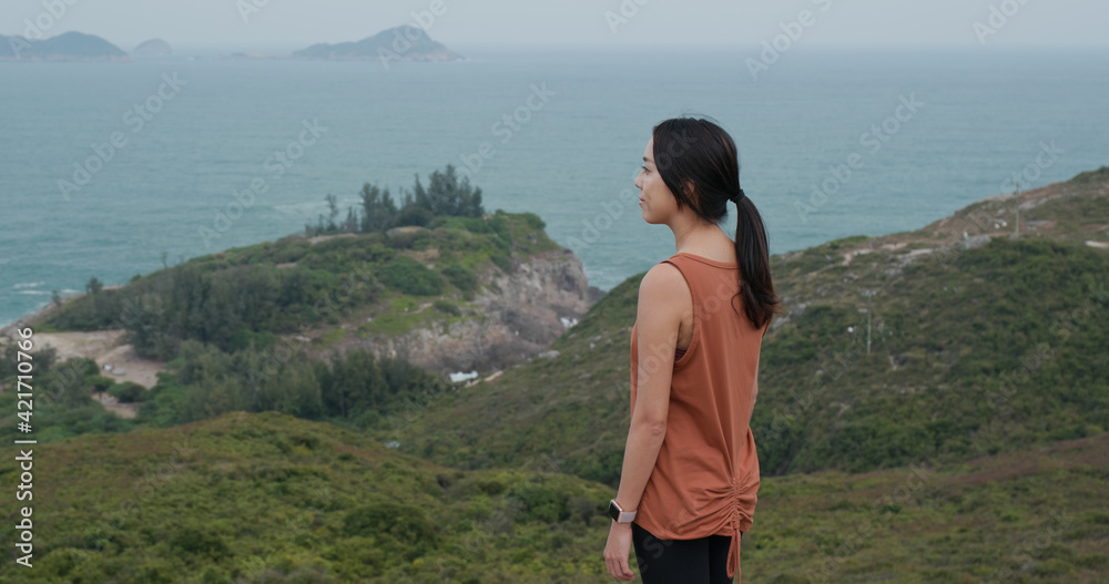 Sport woman stand on the top of mountain Sport woman stand on the top of mountain
