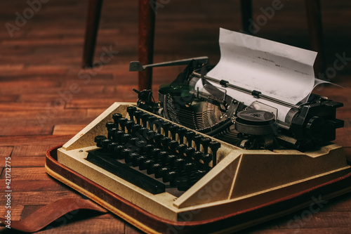 retro typewriter with keys letters wooden background white sheet of paper newspaper