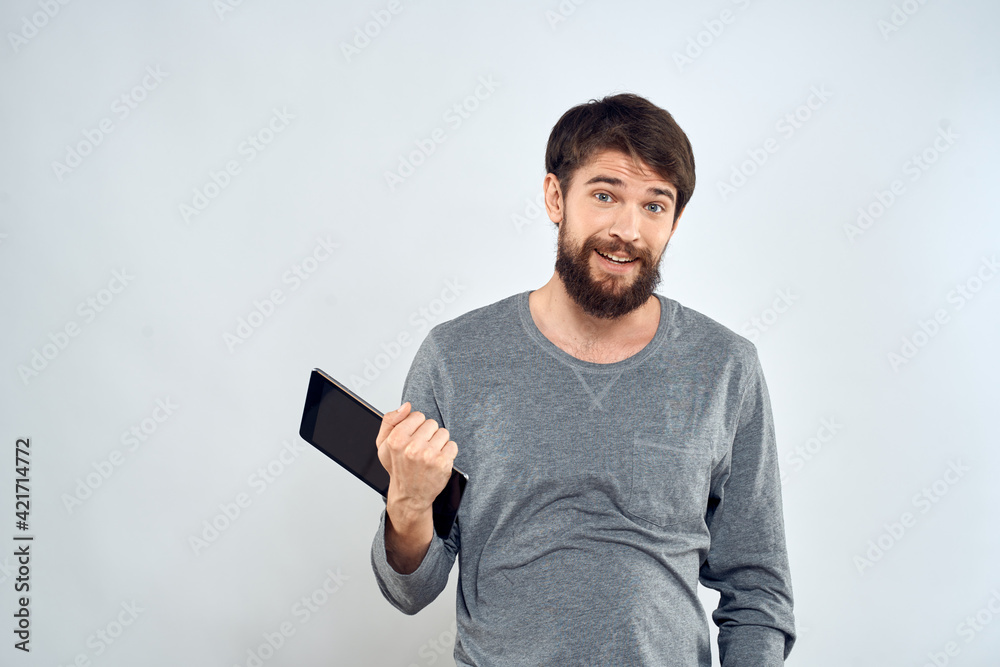 Cropped view of cheerful man with tablet in hands of technology communication lifestyle Cropped view of cheerful man with tablet in hands of technology communication lifestyle