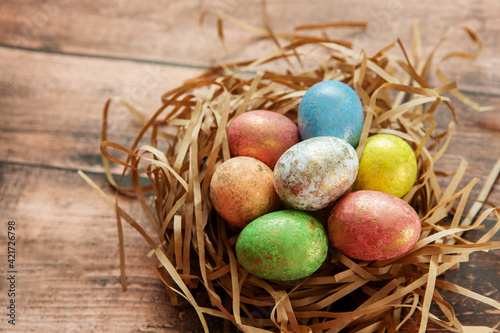 Colorful easter eggs on wooden background. . Happy Easter background.