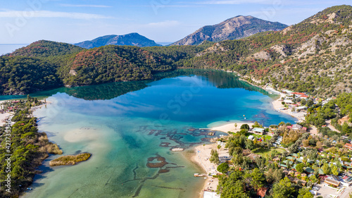 Panoramic and vivid shot of Oludeniz  also known as Blue Lagoon  in Fethiye. It is located on south-west of Turkey and it has been a tourist attraction with its blue sea  weather and coast.