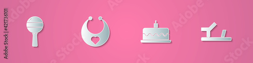 Set paper cut Rattle baby toy, Baby bib, Cake with burning candles and shoes icon. Paper art style. Vector