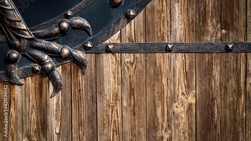 wooden gate with wrought iron elements close up