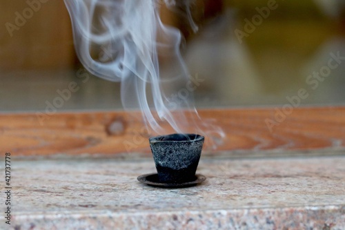 Dhoop wooden stick is burned to produce a pleasant smell for part of a religious ceremony in (Hindu) India