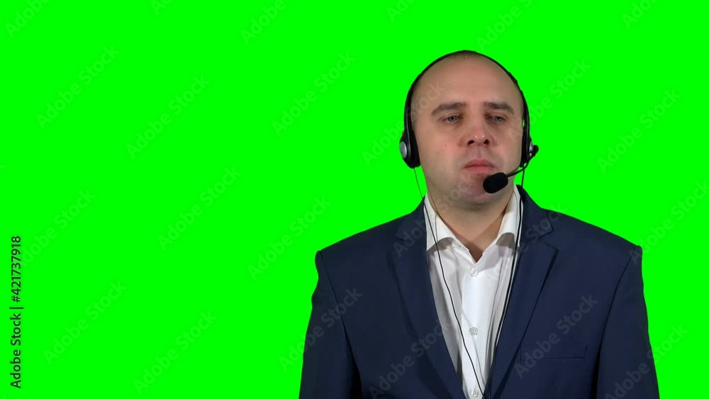 man with headset speaks to client. Green screen background. 4K man with headset speaks to client. Green screen background. 4K