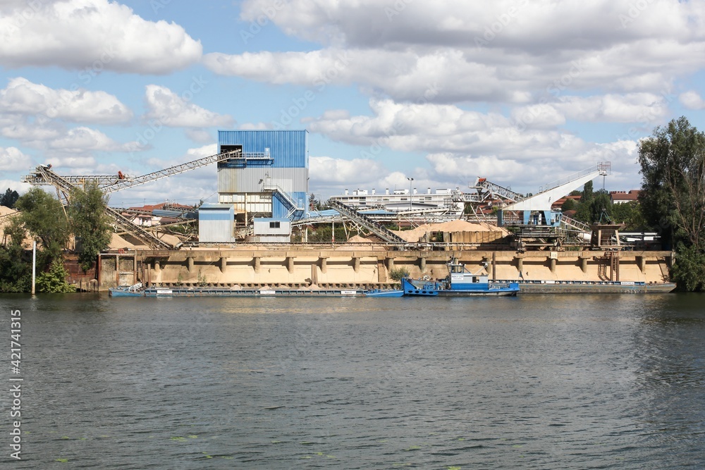 Company manufacturing cement, aggregates and ready-mix concrete in Jassans at the edge of the Saone river Company manufacturing cement, aggregates and ready-mix concrete in Jassans at the edge of the Saone river