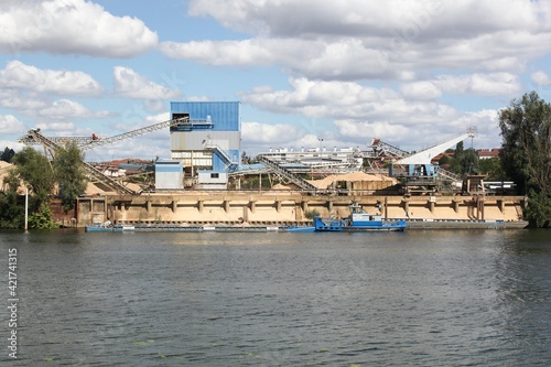 Company manufacturing cement, aggregates and ready-mix concrete  in Jassans at the edge of the Saone river © Ricochet64