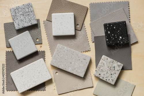 Interior design mood board with fabric , leather and natural stone. Top down view.