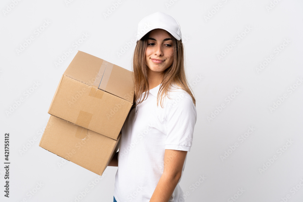 Young delivery woman over isolated white background . Portrait Young delivery woman over isolated white background . Portrait