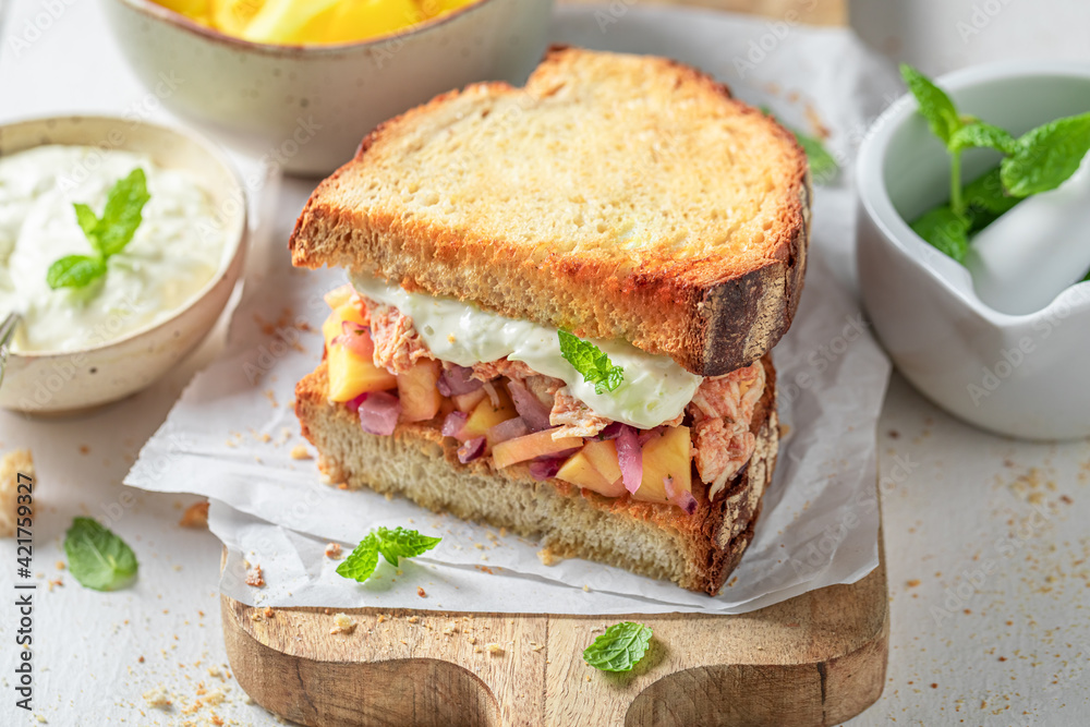 Homemade sandwich with chicken, fruits, onion and herbs. Homemade sandwich with chicken, fruits, onion and herbs.