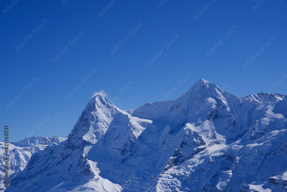 Panorama of Bernese Alps with Mountain Peaks Eiger and Mönch (monk), seen from Mürren, Switzerland.