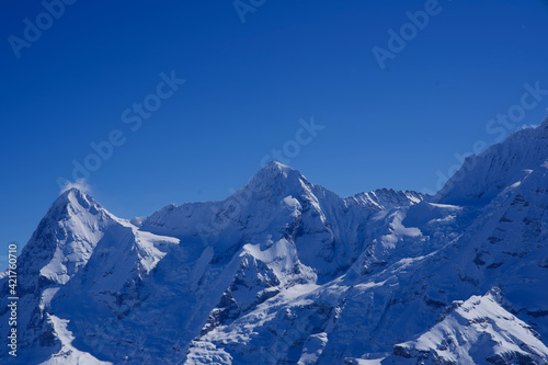 Panorama of Bernese Alps with Mountain Peaks Eiger and M  nch  monk   seen from M  rren  Switzerland.