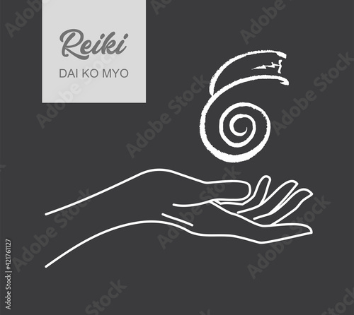 Reiki symbol. A sacred sign DAI KO MIO. A hand holds Reiki DAI KO MIO sign on a black background. Alternative medicine.
