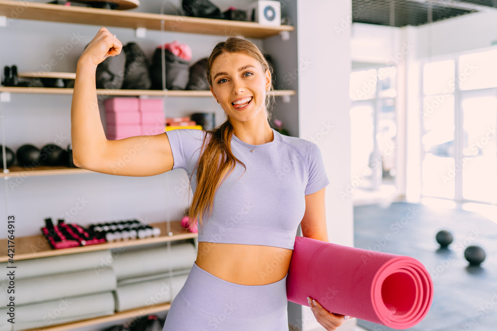 One Arm Model Be Powerful concept. Glad american woman raises arm, shows biceps ...