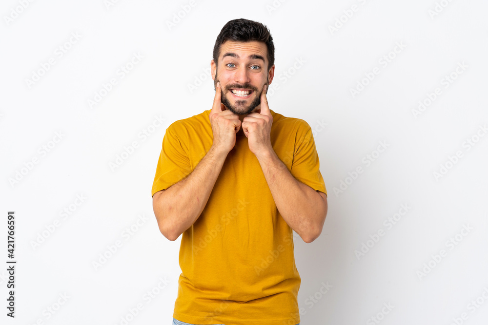 Young handsome man with beard isolated on white background smiling with a happy and pleasant expression Young handsome man with beard isolated on white background smiling with a happy and pleasant expression