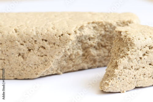 Delicious and sweet halva on a light background.