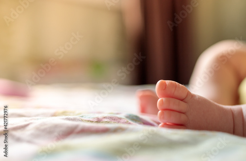 baby leg on blur background close up