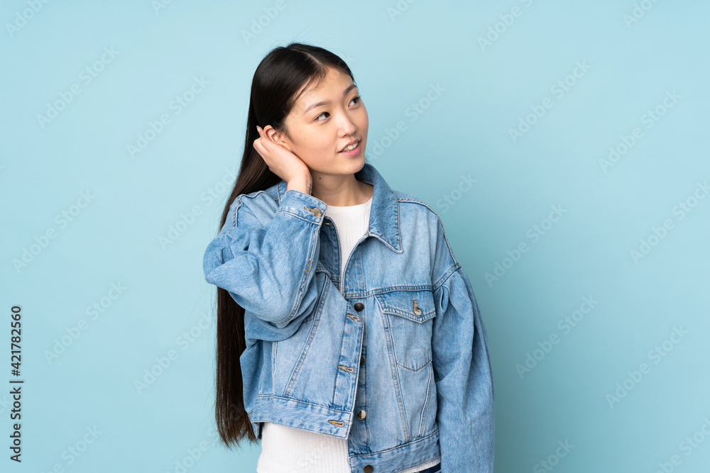 Young asian woman isolated on background thinking an idea Young asian woman isolated on background thinking an idea