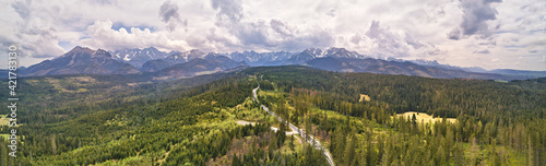 Obraz na płótnie Spring rainy weather mountain panorama. Green forest hills. Road from Poland to Slovakia w salonie
