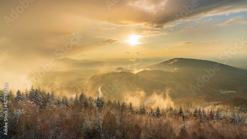 Breathtaking light at the end of a snowstorm in the black forest