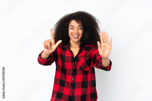 Young african american woman over isolated background counting seven with fingers