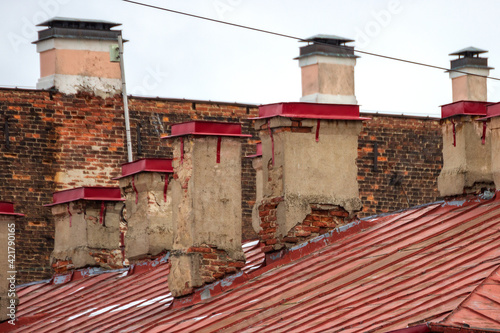Old chimneys on the roof of a building in St. Petersburg.