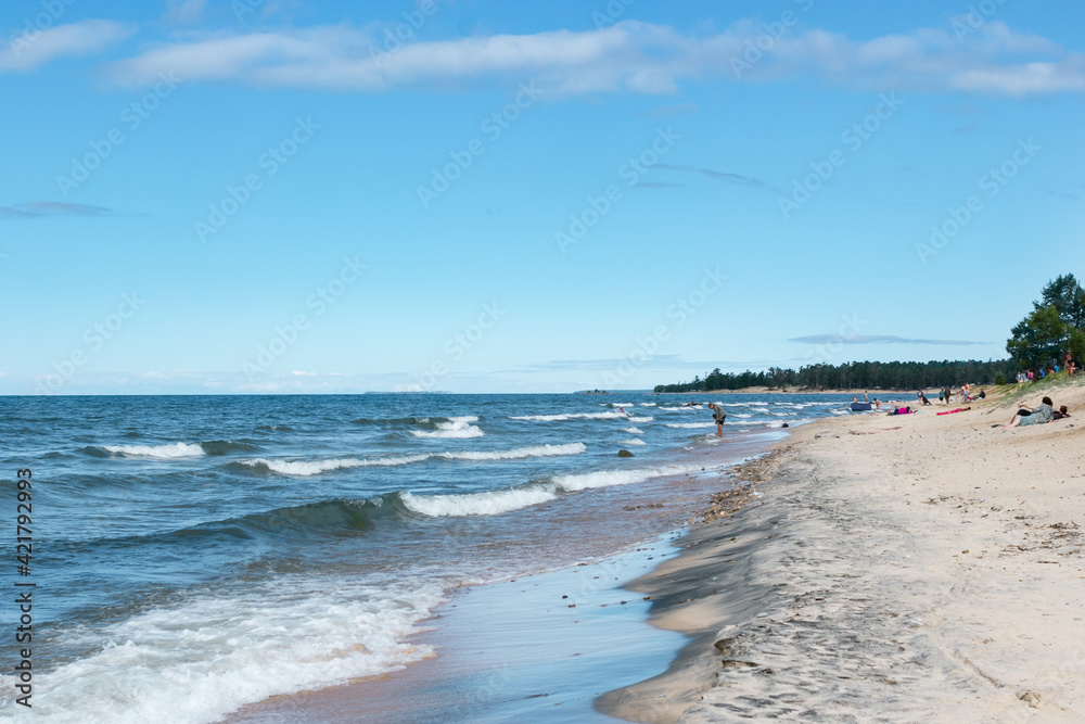 Seascape on the lake Baikal. Froth and waves on wild beach. Summer beach vacation concept. Lifestyle. Seascape on the lake Baikal. Froth and waves on wild beach. Summer beach vacation concept. Lifestyle.