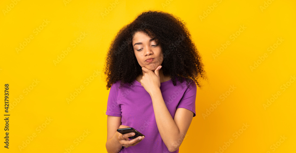 Young african american woman over isolated background thinking and sending a message Young african american woman over isolated background thinking and sending a message