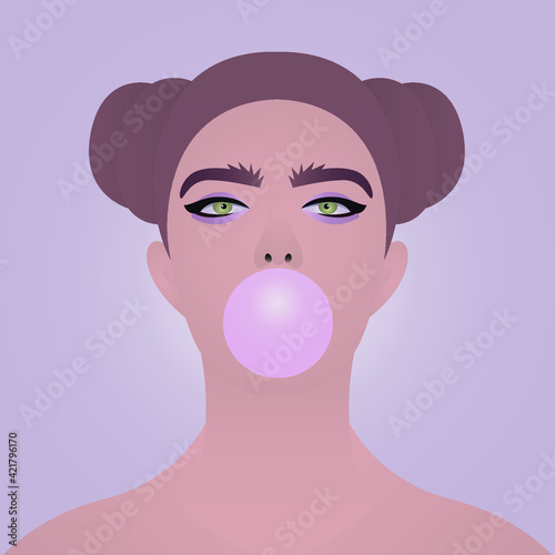 The girl inflates a bubble with chewing gum.