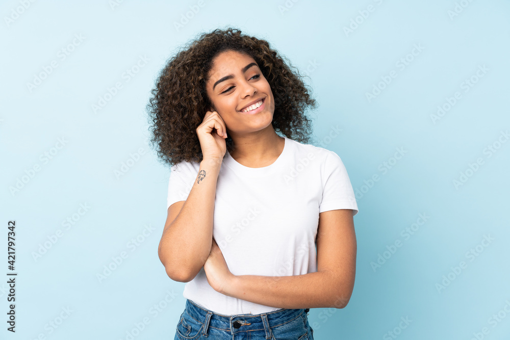 Young African American woman isolated on blue background laughing Young African American woman isolated on blue background laughing