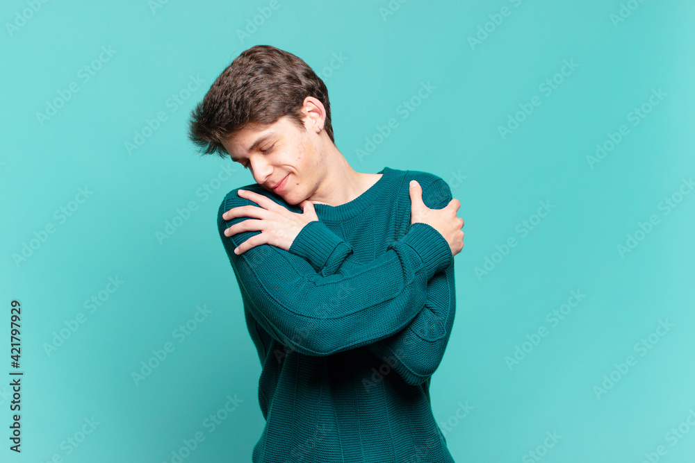 Ταπετσαρία young boy feeling in love, smiling, cuddling and hugging self, staying single, b