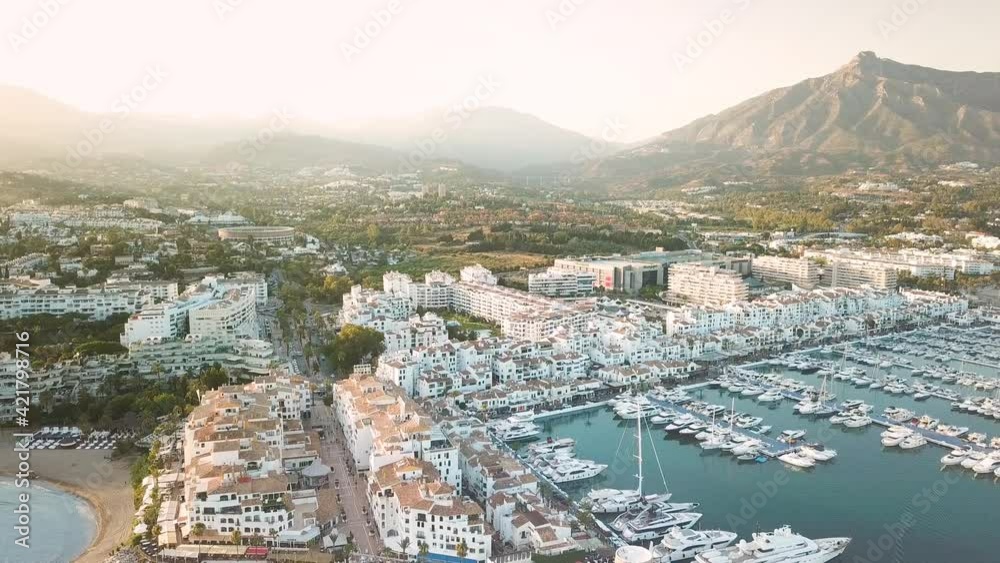 4K aerial perspective of luxury Puerto Banus Bay, exclusive area of Marbella. Famous location for expensive lifestyle , luxury yacht. Drone backward and right rotation 4K aerial perspective of luxury Puerto Banus Bay, exclusive area of Marbella. Famous location for expensive lifestyle , luxury yacht. Drone backward and right rotation