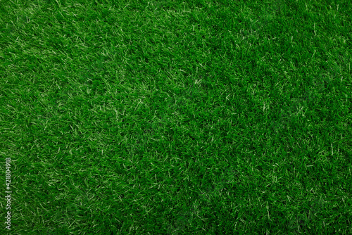 Fake green grass for background texture or backdrop , Artificial Grass Field Top View Texture