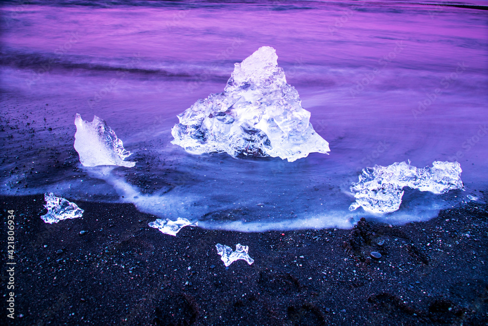 magical charming beautiful landscape with a piece of ice like a sculpture on the Diamond beach near glacier lagoon Jokulsarlon, Iceland. Exotic countries. Amazing places.