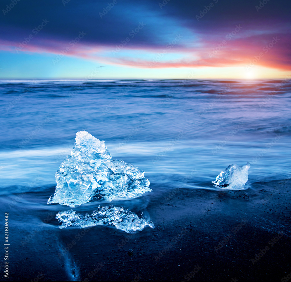 magical charming beautiful landscape with a piece of ice like a sculpture on the Diamond beach near glacier lagoon Jokulsarlon, Iceland. Exotic countries. Amazing places.