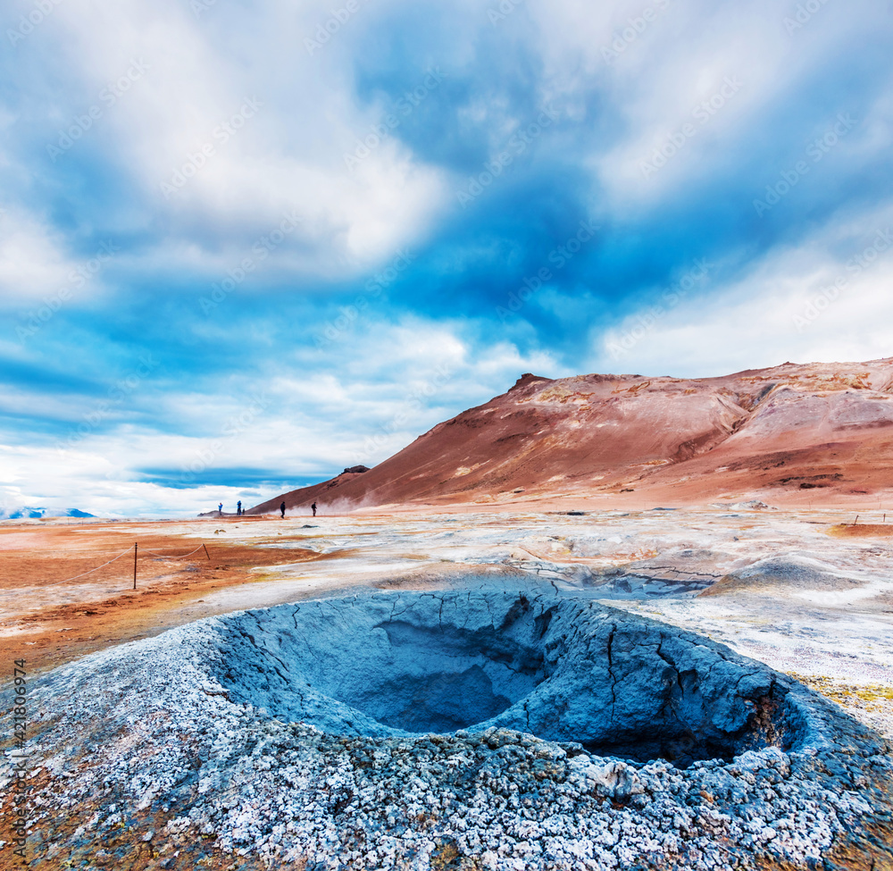 Magical dramatic scene with geothermal swamp and volcanoes in Hverir (Hverarond) valley in the Myvatn region. Iceland. Exotic countries. Amazing places.