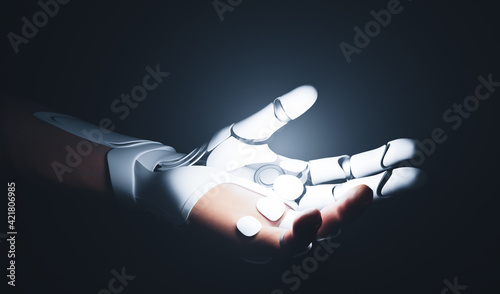 Robotic bionic hand connected with human hand. photo