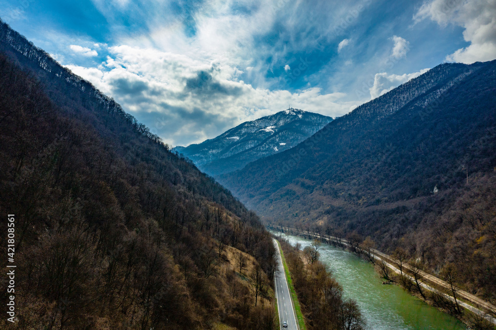 Fototapeta premium Road near river. Bosnia and Herzegowina. Zenica