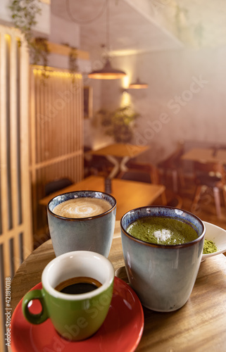 Fototapeta Naklejka Na Ścianę i Meble -  Cups of coffee, espresso and matcha latte